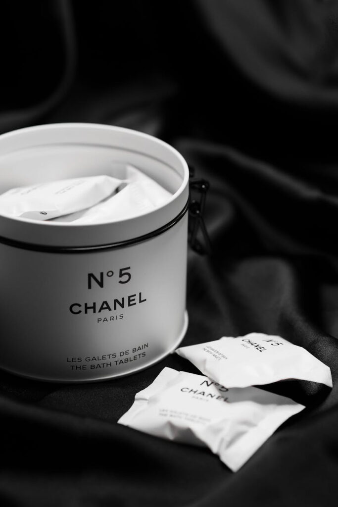 black and white  up close photo of a container of Chanel Number 5